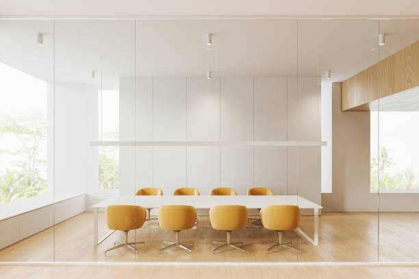 istock Cozy glass conference room interior with table and armchairs, panoramic window 1611532246