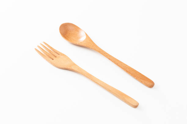 istock Wooden cutlery on white background. 1611540997