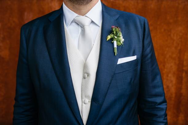 istock man in suit, with blue vest, boutet and rose 1611543093