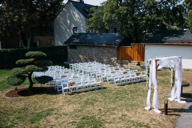 istock an empty white lawn is covered with folding chairs and umbrellas 1611544199