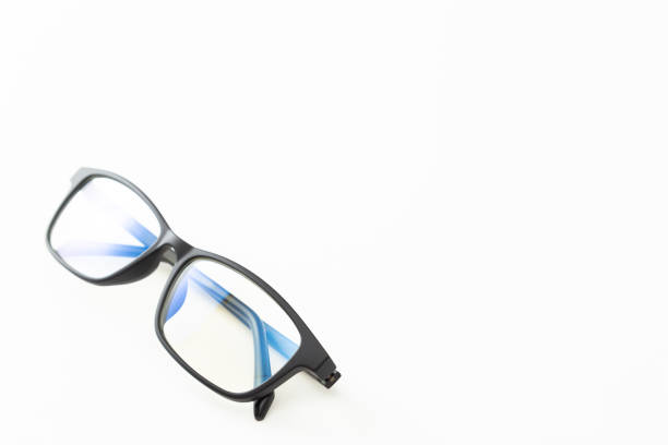 istock Black-rimmed glasses on a white background. 1611549082