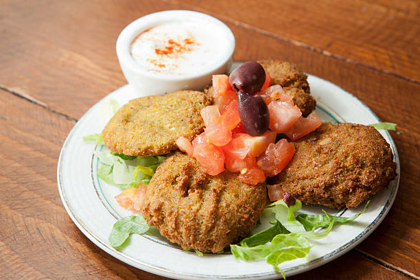 Plate of falafel with yogurt dipping sauce stock photo