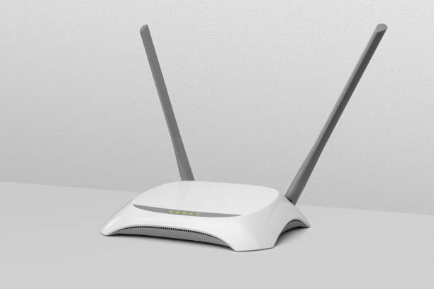 istock WiFi wireless router, copy space. Wireless device for broadband Wi-Fi 6 network in office or home. Secure dual band wireless LAN channel with encryption and firewall. 1611553879