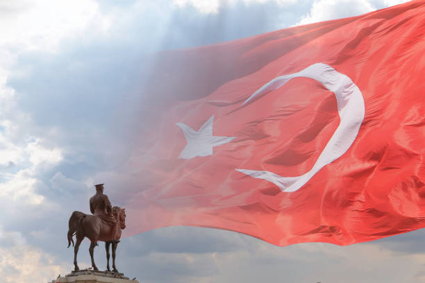 istock Waving Turkish Flag and Ataturk monument 1611558372