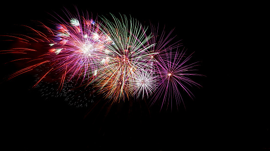 beautiful bright multi-colored fireworks on a black background