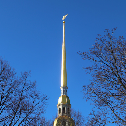 Full frame daylight image of a church tower in front of the blue sky in Germany