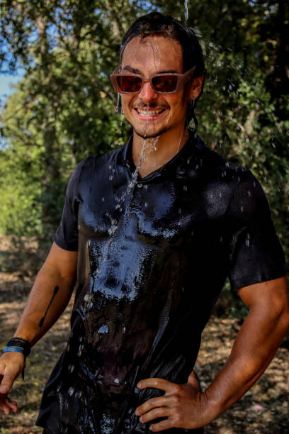 istock Young man soaked at the park 1611621987