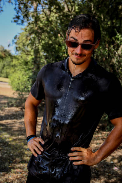 istock Young man soaked at the park 1611622429