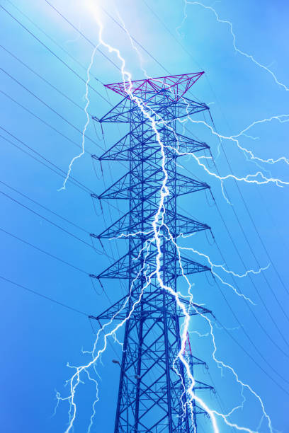 istock High Voltage electric substation with lightning- Electrical short circuit An electrical fault 1611631670