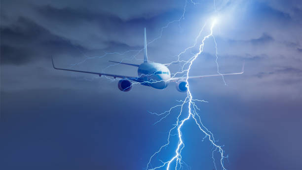 istock Airplane in the sky with thunder and lightning 1611636550