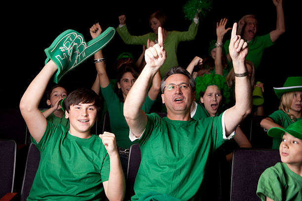 istock Sports Fans: Adults Children Cheering Spectators Event Team Color Green 161164808