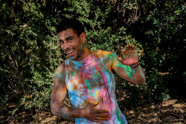 istock Young men playing in a paint fight 1611651607