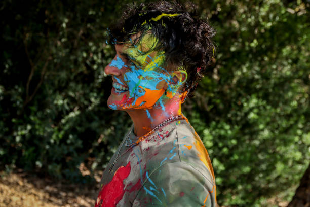 istock Young men playing in a paint fight 1611651616