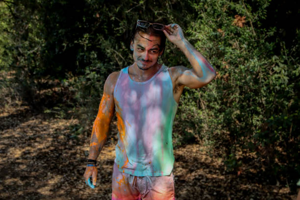 istock Young men playing in a paint fight 1611651620