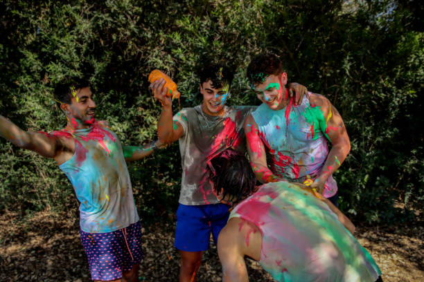 istock Young men playing in a paint fight 1611657981