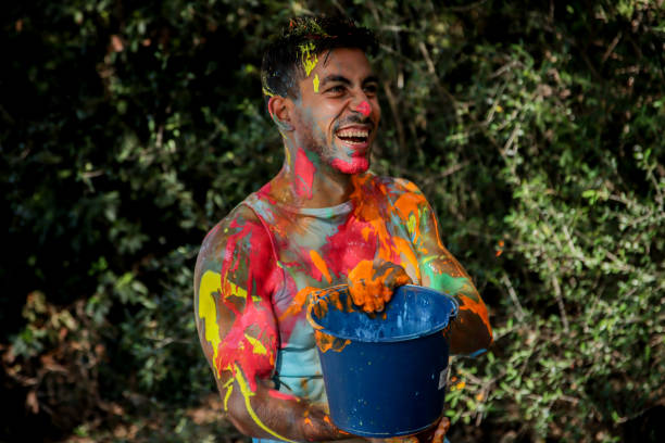 istock Young men playing in a paint fight 1611658004