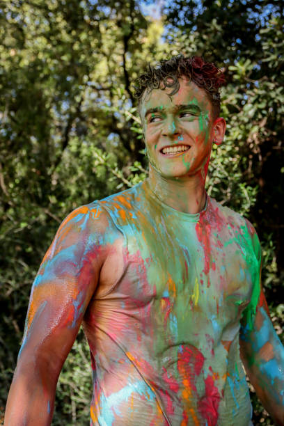 istock Young men playing in a paint fight 1611659365