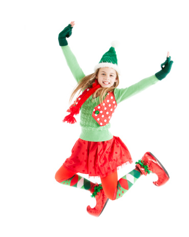 One of Santa's Christmas elves jumps for joy.