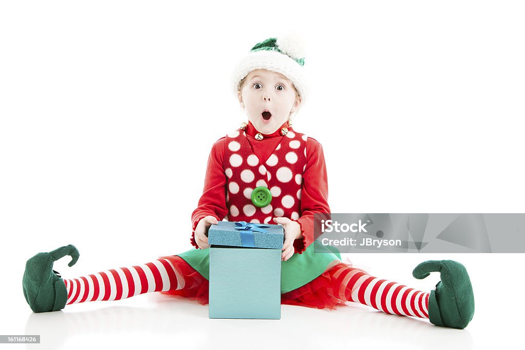 Santas Elf è sorpresa apertura di regalo di Natale - Foto stock royalty-free di Natale