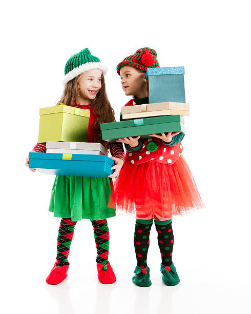 istock Santas Elves Carry Stacks of Wrapped Presents 161169651