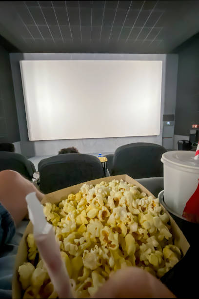 istock young people eating popcorn in a cinema 1611697865