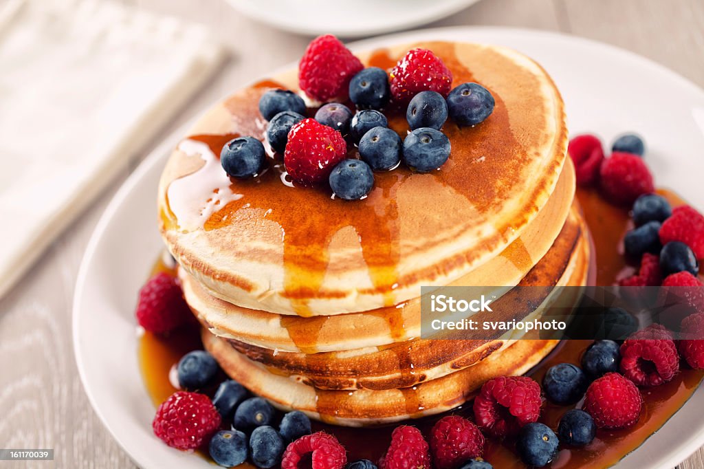 Pancakes with berries and maple syrup Berry Fruit Stock Photo