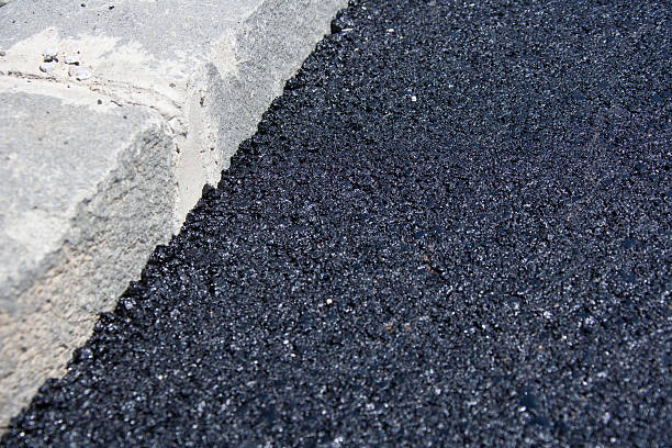 istock Fresh Layer Of Asphalt with Granite Curbs 161170761