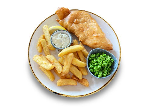 Cod and chips served with mushy peas and tartare sauce.
