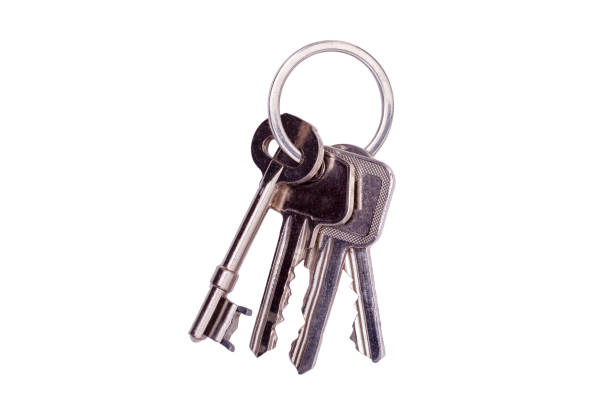 House keys on a keyring isolated on white stock photo