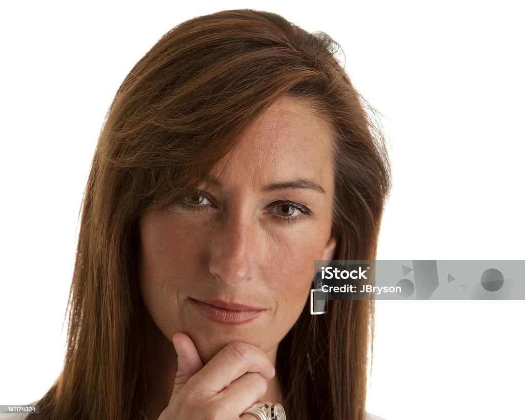 Serious Mid Adult Woman Considering Headshot of a serious adult woman thinking. 40-44 Years Stock Photo