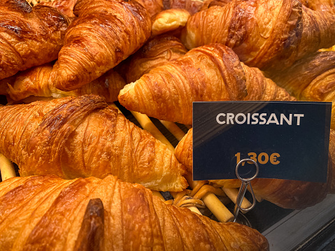 French bread croissant for sale for breakfast with Euro price notice