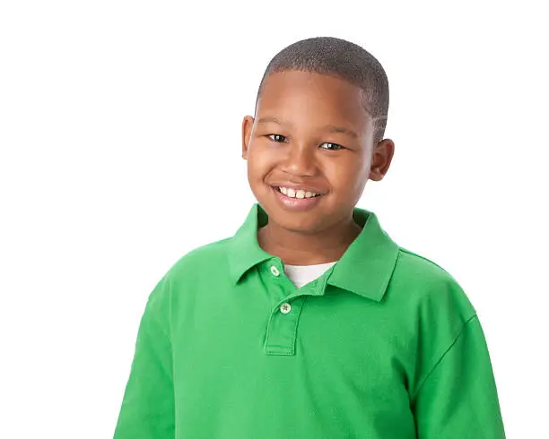 A head and shoulders image of an 8 year old African American little real boy in a bright green shirt and a big smile on his face.   For similar images, please click on the lightboxes below: