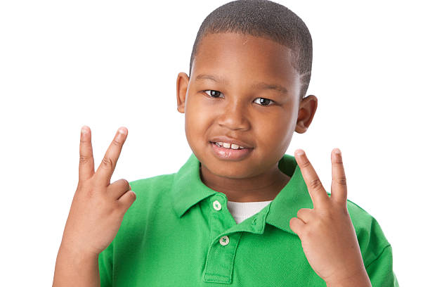 istock Real People: African American Little Boy Peace Sign Head Shoulders 161174536
