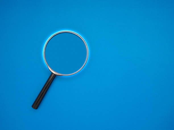 istock A magnifying glass on a blue background with copy space for text 1611781709