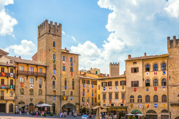 Arezzo, Italy. Old well located on Piazza Grande square at dusk
