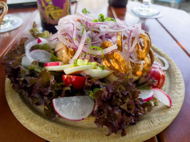 istock Delicious salad with different delicacies 1611792840