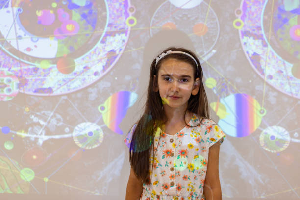 istock Young girl learning about Metaverse and AI 1611828070