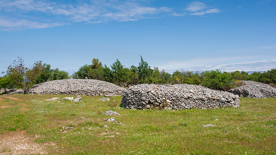 The spring landscape near Nerezisca on Brac Island in Croatia in May, showing the island's characteristic stone mounds and walls