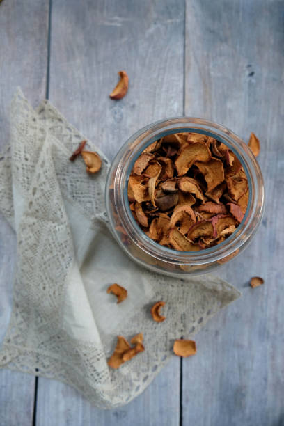 istock dried apples in a jar on gray boards 1611857561