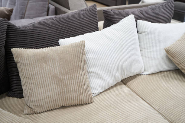 istock Soft pillows and a sofa made of corduroy fabric 1611864279