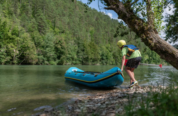 istock Father and son kayaking on the river Kolpa 1611873816
