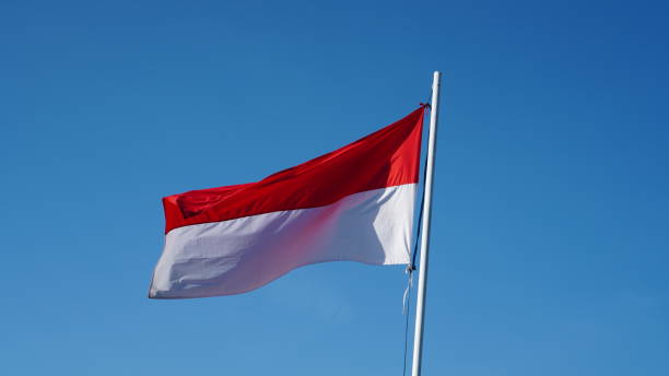 istock red and white flag in the sky 1611886741