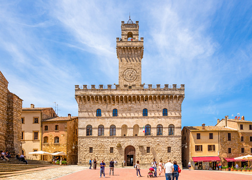 Montepulciano, Italy, June, 24, 2018 - Piazza Grande and Palazzo Comunale of Montepulciano