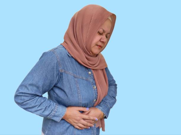 istock Women hands holding stomach 1611944056