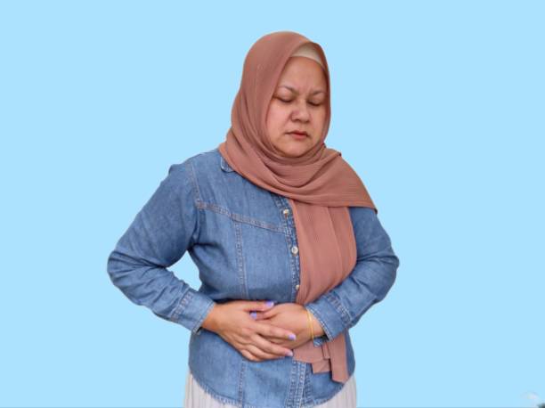 istock Women hands holding stomach 1611944059