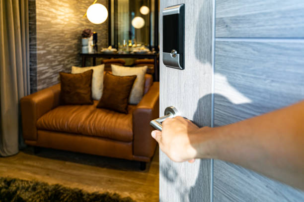 istock Hand open door digital and access control in a condo 1611963216