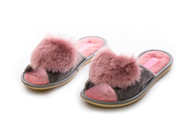 istock Pink  women's slippers on a white background 1611964371