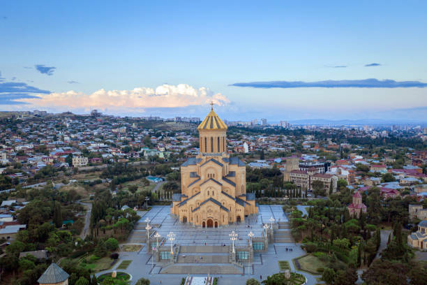 istock Aerial view of downtown district and Holy Trinity church dome or Tsminda Sameba Cathedral 1611977801
