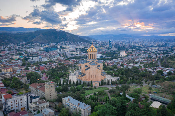 istock Aerial view of downtown district and Holy Trinity church dome or Tsminda Sameba Cathedral 1611978794