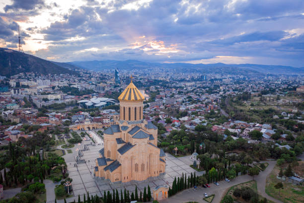 istock Aerial view of downtown district and Holy Trinity church dome or Tsminda Sameba Cathedral 1611979477